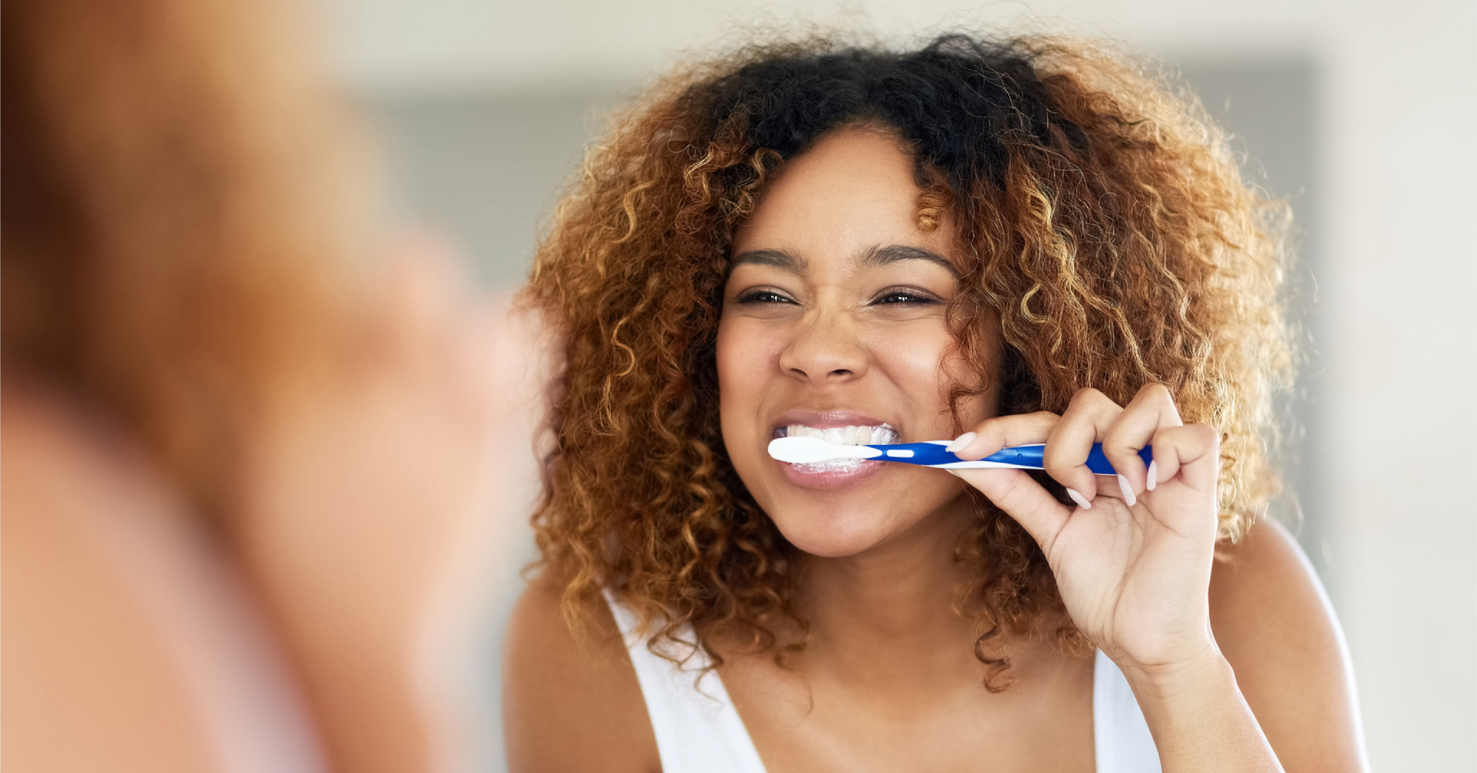 woman practicing dental hygiene